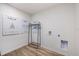 Convenient laundry room with washer, dryer, and hanging rack at 2235 Majestic Span Ave, Eagle Lake, FL 33839