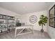 Home office with built-in shelving, a large desk, and plenty of light at 2235 Majestic Span Ave, Eagle Lake, FL 33839