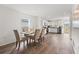 Open concept dining area with a wood table and six chairs at 1017 Ambleside Dr, Haines City, FL 33844