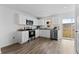 Well-equipped kitchen with white cabinets, granite counters and stainless steel appliances at 1017 Ambleside Dr, Haines City, FL 33844