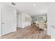 Bright dining room with hardwood floors and view to living room at 2211 Majestic Span Ave, Eagle Lake, FL 33839