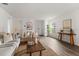 Light and airy living room with hardwood floors and a neutral decor at 2211 Majestic Span Ave, Eagle Lake, FL 33839