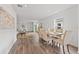 Open dining area with a view of the living room and kitchen at 2211 Majestic Span Ave, Eagle Lake, FL 33839