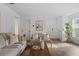 Living room with a sofa, chairs, and a large window at 2211 Majestic Span Ave, Eagle Lake, FL 33839