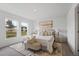 Spacious bedroom with plush bedding and ample natural light at 2211 Majestic Span Ave, Eagle Lake, FL 33839