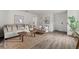 Cozy living room featuring a neutral color palette and hardwood floors at 2211 Majestic Span Ave, Eagle Lake, FL 33839