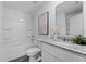 Clean bathroom, granite countertop, white cabinets, and a shower/tub combo at 2211 Majestic Span Ave, Eagle Lake, FL 33839