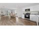 Open concept kitchen with stainless steel appliances and dining area at 2211 Majestic Span Ave, Eagle Lake, FL 33839