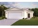 Charming single-story home with a welcoming front porch and landscaped yard at 2374 Aquiline Nest St, Eagle Lake, FL 33839