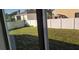 Grass backyard with a privacy fence at 1412 Swan Ct, Poinciana, FL 34759