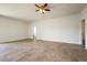 Large living area with tile flooring and access to other rooms at 802 Fraser Dr, Poinciana, FL 34759
