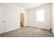 Bright bedroom with grey carpet and private bathroom at 802 Fraser Dr, Poinciana, FL 34759