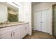 Double vanity bathroom with granite countertops and tile flooring at 802 Fraser Dr, Poinciana, FL 34759