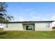 Single-story home with modern design and grassy yard at 802 Fraser Dr, Poinciana, FL 34759