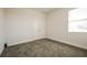 Well-lit bedroom with grey carpet and double doors at 802 Fraser Dr, Poinciana, FL 34759
