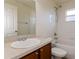 Clean bathroom with single vanity, tub, and shower at 8021 Princeton Manor Cir, Lakeland, FL 33809