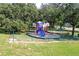 Community playground with playset, benches, and fenced area at 15718 Heron Hill St, Clermont, FL 34714