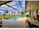 Private pool and patio area with screened enclosure at 15718 Heron Hill St, Clermont, FL 34714