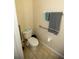 Small bathroom with toilet and grab bars at 2033 Estancia Cir # B, Kissimmee, FL 34741