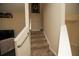 Carpeted staircase with metal railings leading upstairs at 2033 Estancia Cir # B, Kissimmee, FL 34741