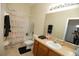 Main bathroom with tub shower combo and vanity at 2033 Estancia Cir # B, Kissimmee, FL 34741