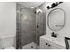 Clean bathroom with gray tile shower and white vanity at 2203 Nottingham Rd, South Daytona, FL 32119