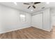 Bright bedroom with wood-look floors and ample closet space at 2203 Nottingham Rd, South Daytona, FL 32119