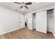 Spacious bedroom with wood floors, ceiling fan and closet at 2203 Nottingham Rd, South Daytona, FL 32119