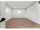 Simple bedroom with hardwood floors and neutral walls at 2203 Nottingham Rd, South Daytona, FL 32119