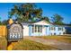 Charming light blue house with a well-maintained lawn at 2203 Nottingham Rd, South Daytona, FL 32119