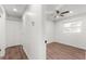 Light hallway with wood-look floors and access to bedrooms at 2203 Nottingham Rd, South Daytona, FL 32119