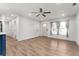 Bright living room with hardwood floors and ceiling fan at 2203 Nottingham Rd, South Daytona, FL 32119