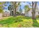 Large backyard with mature trees and a wooden fence at 4251 Tangerine Ave, Sanford, FL 32773