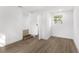 Spacious bedroom with wood-look flooring and neutral walls at 4251 Tangerine Ave, Sanford, FL 32773
