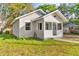 Charming bungalow exterior with a covered porch and well-maintained lawn at 4251 Tangerine Ave, Sanford, FL 32773