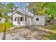 Updated bungalow exterior with front porch and mature landscaping at 4251 Tangerine Ave, Sanford, FL 32773