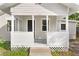 Quaint front porch with white railings and wooden flooring at 4251 Tangerine Ave, Sanford, FL 32773