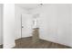 Bright hallway with wood-look flooring and white walls at 4251 Tangerine Ave, Sanford, FL 32773