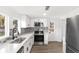 Stylish kitchen featuring stainless steel appliances and white cabinetry at 4251 Tangerine Ave, Sanford, FL 32773