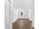 Light-filled living room with hardwood floors and white walls at 4251 Tangerine Ave, Sanford, FL 32773