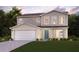 Two-story house with a large garage and well-manicured lawn at 1705 Seabass Ln, Poinciana, FL 34759