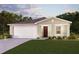 One-story home with a two-car garage and landscaped lawn at 401 Baltic Ct, Poinciana, FL 34759