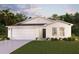 Charming single-story home with a two-car garage and inviting landscaping at 3453 Dahlia Dr, Lake Hamilton, FL 33851