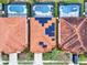 Three homes with solar panels and tile roofs at 5240 Oakbourne Ave, Davenport, FL 33837
