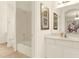 Clean bathroom with a tub, shower, and updated vanity at 5240 Oakbourne Ave, Davenport, FL 33837