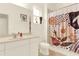 Bathroom with a shower/tub combo and modern vanity at 5240 Oakbourne Ave, Davenport, FL 33837