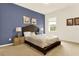 Spacious bedroom with a plush bed and accent wall at 5240 Oakbourne Ave, Davenport, FL 33837