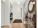 Bright and spacious entryway with tile flooring and elegant console table at 5240 Oakbourne Ave, Davenport, FL 33837