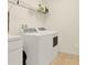 Convenient laundry room with washer and dryer at 5240 Oakbourne Ave, Davenport, FL 33837