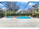 Relaxing screened-in pool area with lounge chairs at 5240 Oakbourne Ave, Davenport, FL 33837